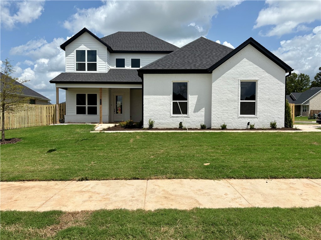 Pea Ridge is an up-and-coming community in Northwest Arkansas, Yorktown offers the perfect opportunity to find your dream home. This affordable, scenic, and well-maintained area caters to a variety of lifestyles, making it an ideal place to live. Upon entering the Willow Plan, you're welcomed by a charming front porch. Inside, an office space with wood accent walls greets you, LVP leads you into the open-concept living, kitchen, and dining area. The kitchen is equipped with 3CM granite countertops, custom cabinets, and a beautifully crafted wood hood. Conveniently located off the garage are cubbies, the utility room, and a powder room. The primary bedroom features exposed beams and an ensuite bathroom. Upstairs, you'll find three additional bedrooms, each with spacious walk-in closets.The covered back patio, perfect for relaxing or entertaining.For a limited time rates starting at 4.99% OR $7,500 from builder & up to $4K from preferred lender.