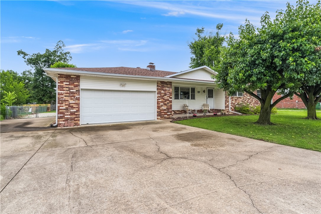 This pristine home is located right in the heart of Rogers in a well established area! Blocks from Rogers High School and the Razorback Greenway. Central to entertainment, dining, shopping, with easy access to the interstate and airport. Ranch-style layout with a nice sized living room and eat-in dining area right off the kitchen. Huge pantry with extra storage space and laundry room. 3 Bedrooms, 2 Baths. Some notable features include a new roof in 2024, fence in 2019, HVAC in 2015, a tornado shelter built into the garage floor, oversized garage, and nice driveway with extended parking. A double gate with extra parking in back fit for an RV. Leaf filters help to keep the gutters clog free. The large backyard is a blank canvas with lots of room to move and play. Property has been pre-inspected and maintained very nicely. You won't want to miss it!