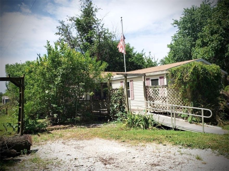 Explore this attractive investment opportunity in a scenic country setting.  A charming three bedroom, two bath home is nestled on a .63 acre lot, providing a serene ambiance while being conveniently located near the amenities of a small town.  The property is sold “As Is”.