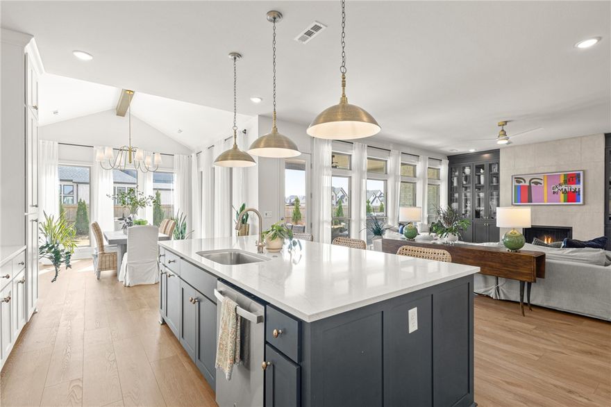 Move-in ready Evening Star residence showcasing refined upgrades & exceptional attention to detail. Professionally landscaped grounds set the tone for an impeccably curated interior featuring designer lighting, custom fireplace surround, stair runner, drapery & automated blinds. Main living area offers a serene, light-filled space with built-ins and a statement fireplace. Kitchen is appointed with quartz countertops, gas cooktop, built-in oven & walk in pantry. Elegant dining space. Enjoy outdoor living on the covered patio. Functional luxury continues with a spacious laundry and mudroom off the 3-car garage. The main level hosts two guest suites with walk-in closets and a dual-vanity guest bath. The private primary retreat features wood floors, abundant natural light, and a spa-inspired bath with soaking tub, large walk-in shower, and WIC. Upstairs offers a secondary living area and en-suite bedroom. All located in highly sought after community with amenities, near schools, and Pinnacle district.