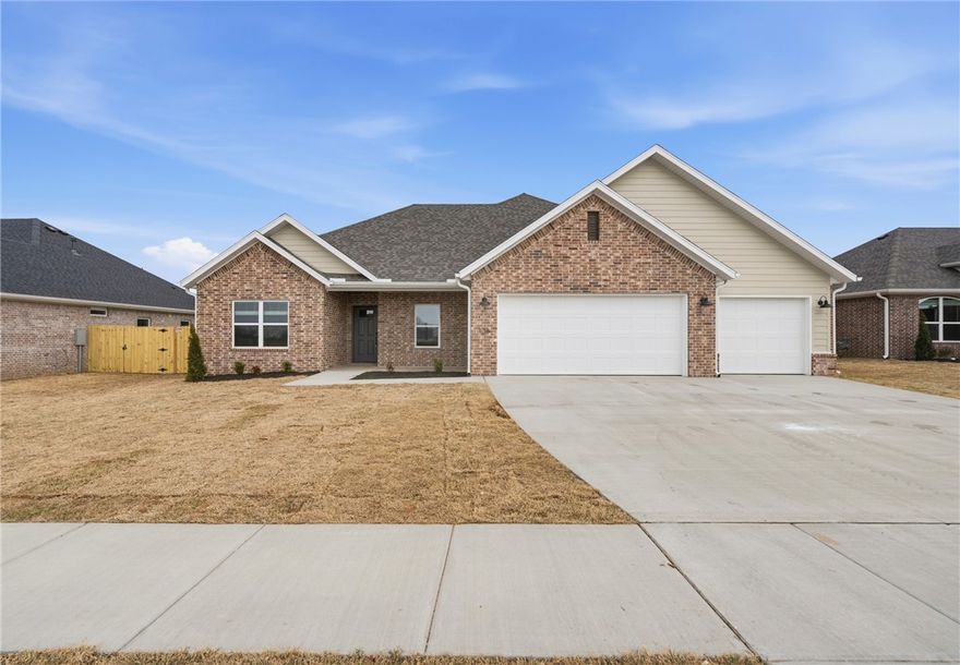 Beautiful new construction with a 3-car garage in a sought-after neighborhood! This quality-built home features an open layout with a vaulted ceiling and gas log fireplace in the living area. The kitchen offers white cabinetry with soft-close doors and drawers, quartz countertops, stainless steel appliances including a 5-burner gas range, a walk-in pantry, and under-cabinet lighting. The Owner’s Suite boasts a double vanity, soaking tub, large tiled shower, and a spacious walk-in closet.  Energy-efficient upgrades include solar decking in the attic. Outside enjoy a covered patio, full sod, gutters, blinds, and a fully fenced yard—ready for move-in. Conveniently located near schools, parks, and restaurants, this home checks every box!