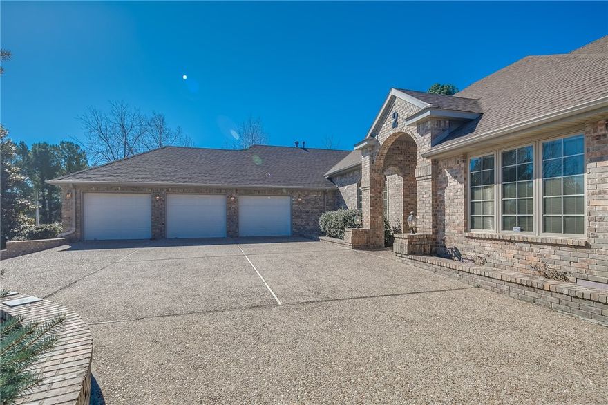 Hilltop estate, all brick custom built by Don Seba. Features light & bright open split floor plan, library, 2 master suites, Jacuzzi & sauna, chef kitchen, large pantry, miles of Corian counters, "Versa" cabinetry, generous walk-in closets, glassed in sunroom with brick walls as back drop and stone tile floors, formal living and, dining room. Large Family Room. Safe room/storm shelter. 3-car oversized garage with deep inset perfect for boat storage and additional toys and workshop. Includes extra flat lot. Newer roof and HVAC. See MLS 1079379 for the additional 3rd lot.