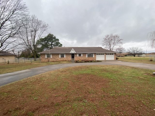 Well maintained 1924 sq ft brick home on 4.35 acres in north springdale. This home has 4 bedrooms, 2 bathrooms, large living room and nice kitchen with eat in bar. Large mud room with plenty of storage off utility room leading to 2 car garage. 4.35 acres is fenced and cross fenced with 1500 sq ft workshop/barn. Other amenities include wood burning fireplace insert, paved circle drive and 10 x 16 storage building. Refrigerator, microwave and washer/dryer convey with a full price offer. Great location within city limits. Home has septic with city water. Home is vacant and ready to show.