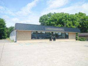 Ready made Commercial Building & Lot for retail or service business. Large a acre lot with 29 designated and paved parking slots. The interior is a wide open 8,640 square feet with the interior walls lined with grooved paneling for retail shelving. Along the back wall is a portioned office, kitchen, two bathrooms and a large warehouse/work area. The roof is steeled framed with a metal roof.