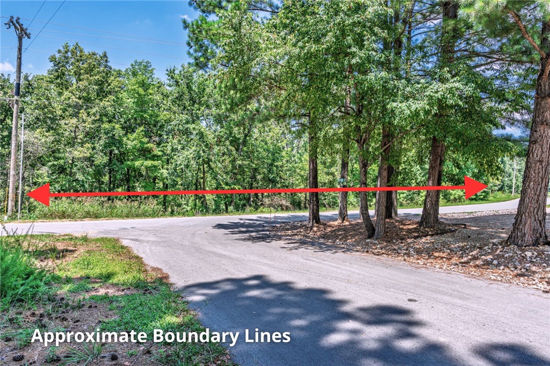 Three consecutive wooded lots totaling 0.86 acres in scenic Bella Vista! Level at the street with a gentle slope, these lots offer flexible building optionsāconstruct a spacious one-level ranch home spanning all three lots, or build on the middle lot with a walk-out basement and enjoy added privacy on both sides. Located just minutes from Branchwood Fitness Center, walking trails, the Highlands Golf Course, and picturesque Loch Lomond. A rare opportunity for privacy, convenience, and access to Bella Vista's 7 lakes, golf courses, trails, restaurants, and 3 fitness facilities.