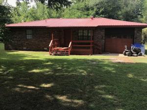 Large Kitchen, survey in file, tile floors, metal roof, Lone Pine, 1 car garage, deck, Central heat and seller will fix outside ac unit, range and ref. incl, newer hot water tank, one owner home, 1995 model;, new ceiling fans in bedrooms.