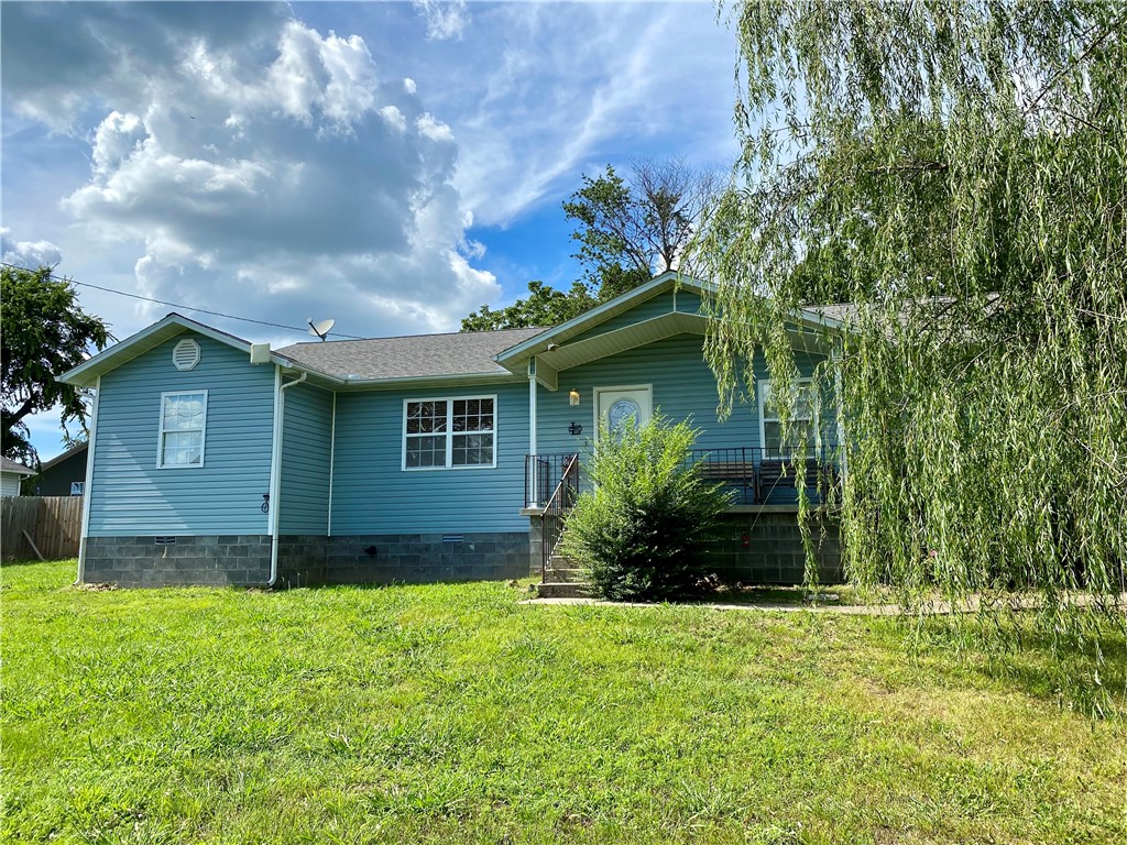 Welcome to 1202 McKennon St, a warm and inviting country home situated on a spacious 0.38-acre corner lot in a quiet, established Berryville neighborhood. Offering approximately 1,900 square feet of comfortable living space, this 4 bedroom, 2 bathroom home is perfect for families, retirees, or anyone looking for peaceful small-town living with modern convenience. The open living and kitchen areas are filled with natural light and flow easily, creating a perfect space for gathering and entertaining. Outside, you'll fall in love with the serene setting, especially the stunning weeping willow tree that graces the front yard, offering shade and charm throughout the seasons. The fenced backyard provides plenty of space for kids, pets, or even your own pool. Located just minutes from schools, shopping, and downtown, this move-in ready home is truly a must-see. Schedule your private showing today!