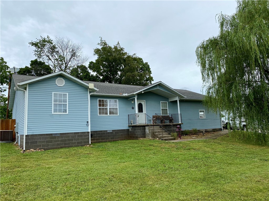 Welcome to 1202 McKennon St, a warm and inviting country home situated on a spacious 0.38-acre corner lot in a quiet, established Berryville neighborhood. Offering approximately 1,900 square feet of comfortable living space, this 4 bedroom, 2 bathroom home is perfect for families, retirees, or anyone looking for peaceful small-town living with modern convenience. The open living and kitchen areas are filled with natural light and flow easily, creating a perfect space for gathering and entertaining. Outside, you'll fall in love with the serene setting, especially the stunning weeping willow tree that graces the front yard, offering shade and charm throughout the seasons. The fenced backyard provides plenty of space for kids, pets, or even your own pool. Located just minutes from schools, shopping, and downtown, this move-in ready home is truly a must-see. Schedule your private showing today!
