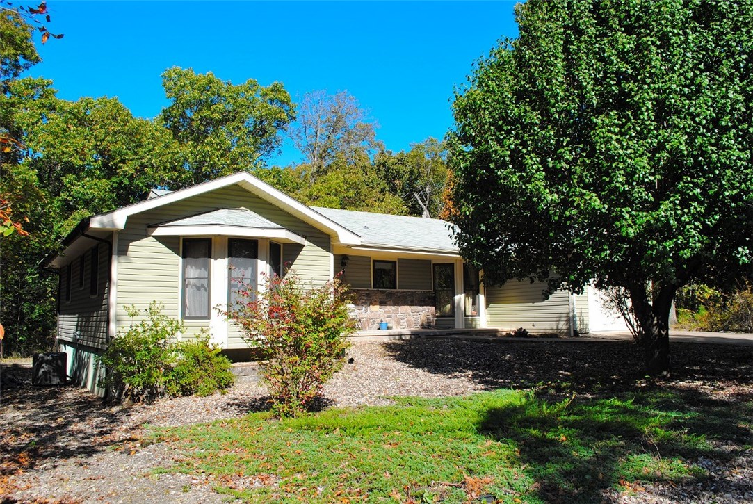 One owner home in quiet area of the Highlands. 1,416 s.f. with 2 bedrooms, 1 full bath and 1 half bath. Nicely appointed kitchen with lots of cabinets, large living room with wood burning fireplace. There is a 16 x 16 sun room with window unit (not included in s.f.) & the garage is 23 x 15. Level drive & yard, Oxidizer on clothes washer, reflective foil in attic, whole house electricity optimizer, heat pump is 2007, roof 2006, located close to Branchwood Rec center & Loch Lomond Stoneykirk boat ramp.