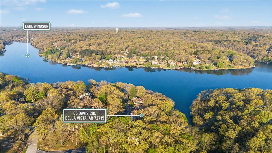 Positioned next to Lake Windsor, 65 Davis Cir offers a rare blend of lifestyle & income potential in Bella Vista. Currently operating as a successful short-term rental, this property gives buyers flexibility - continue generating revenue or enjoy it as a full-time residence or second home.

Location is the driver here with view being lake front, minutes from lake access, the Back 40 trail system, golf courses, & everything that makes Bella Vista one of Northwest Arkansas’ most sought-after outdoor communities. Easy access into Bentonville adds long-term upside with proximity to the Walmart campus, dining, & entertainment.

Whether you’re looking for a turnkey STR, a weekend retreat, or a place to plug into the NWA lifestyle, this is the kind of opportunity that checks multiple boxes in one move.