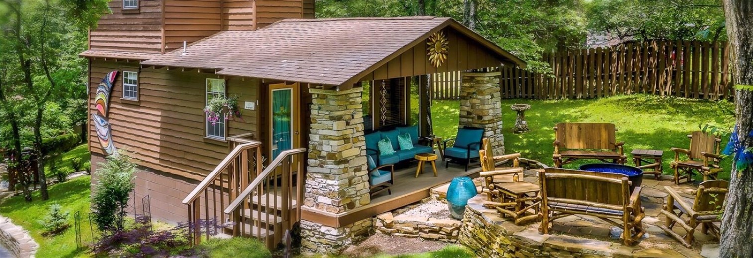 The Woods Cabins is a lodging property with five cabins, comprising 5 individual guest units within a short walk of downtown Eureka Springs, AR. Located on one acre of pristine and well manicured property, the Woods Cabins is a 5 star resort with impressive accommodations including inside the units and on the grounds. The owners have thought of every little detail to please guests in each unit. The owners chose the finest of everything, from the outdoor lighting and seating to the microwave, small stove and coffee makers in the charming kitchenettes. Heated bathroom floors, wood floors, whirlpool tubs, private decks and patios and beautiful furnishings throughout are just a few outstanding features at The Woods Cabins. These cabins provide a fantastic place to stay while visiting Eureka Springs. Hardly any other property in the city combines both the rustic luxury, private setting “in the woods” yet just a few short minutes’ walk down the hill to downtown.