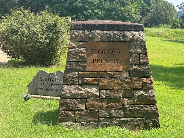 Exceptional Mount Sequoyah lot nestled in one of Fayetteville’s most sought-after locations, this rare vacant lot on the mountain offers an incredible opportunity to build your dream home in the heart of the Ozarks. This serene and private property boasts mature trees, gentle slopes, and gorgeous views—perfectly blending natural beauty with city convenience. Enjoy being minutes from Fayetteville’s vibrant downtown square, Dickson Street, the University of Arkansas, and the extensive network of trails and parks that define the area. Whether you're looking to build a peaceful retreat or a modern custom residence, this lot provides the ideal canvas with all utilities available at the street. Don’t miss your chance to own a piece of historic Mount Sequoyah—where charm, community, and location come together..