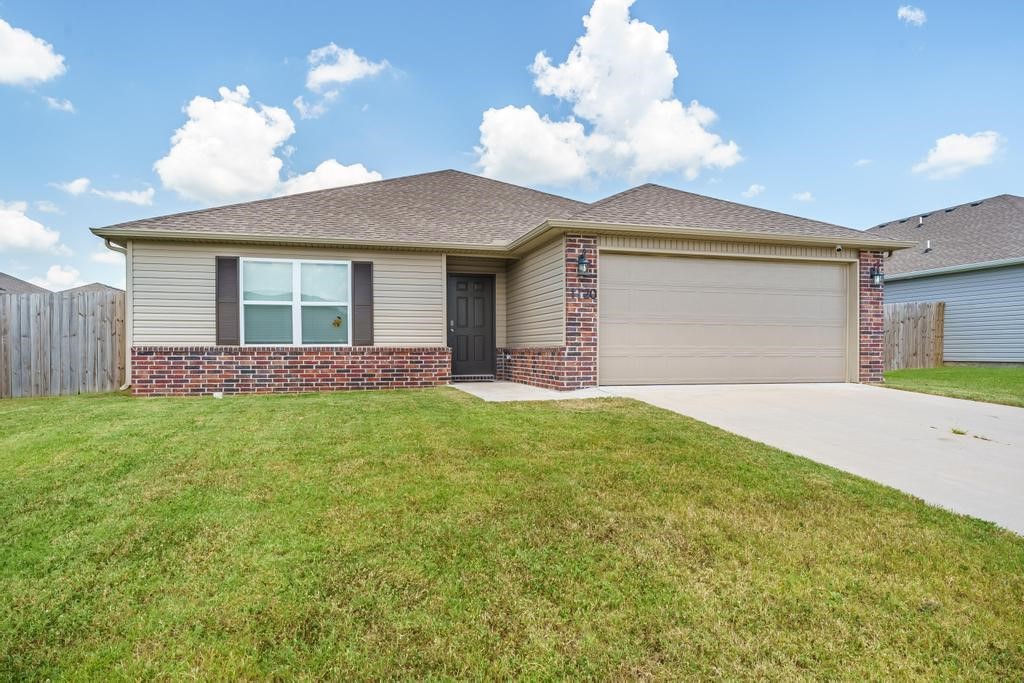 Welcome to 1720 Greenbank Drive in Centerton, AR. This 3-bed, 2-bath home was built in 2022 and has been immaculately cared for. The open concept living room & kitchen flow perfectly for entertaining and everyday living. The kitchen is at the heart of the home and features stainless steel appliances, bar seating space, beautiful counters and tons of cabinet space. The door off the dining space leads to the covered patio and fenced in backyard. Just off the kitchen is the laundry room and large pantry, which then leads to the 2-car garage. The primary suite is just off the living room and includes a large walk-in closet, walk-in shower, large countertop & floating shelves. Two additional bedrooms are at the front of the house near the secondary full bathroom. Beautiful LVP flooring flows throughout the main living area with carpet in the bedrooms. Located close to Centerton Gamble Elementary, Bentonville West High School & Kinyon Sports Complex.