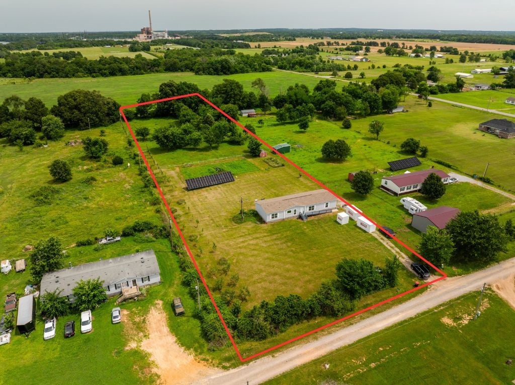 Well cared for manufactured home on permanent block foundation. 4 bedrooms, 2 full baths, and ample storage on 2.5 acres. You will love the oversized laundry room and eat-in kitchen. Solar panels convey with home and provide low cost electric bills. Young orchard on property with apple and peach trees! The storage shed conveys. Schedule a showing today. This one will not last long.