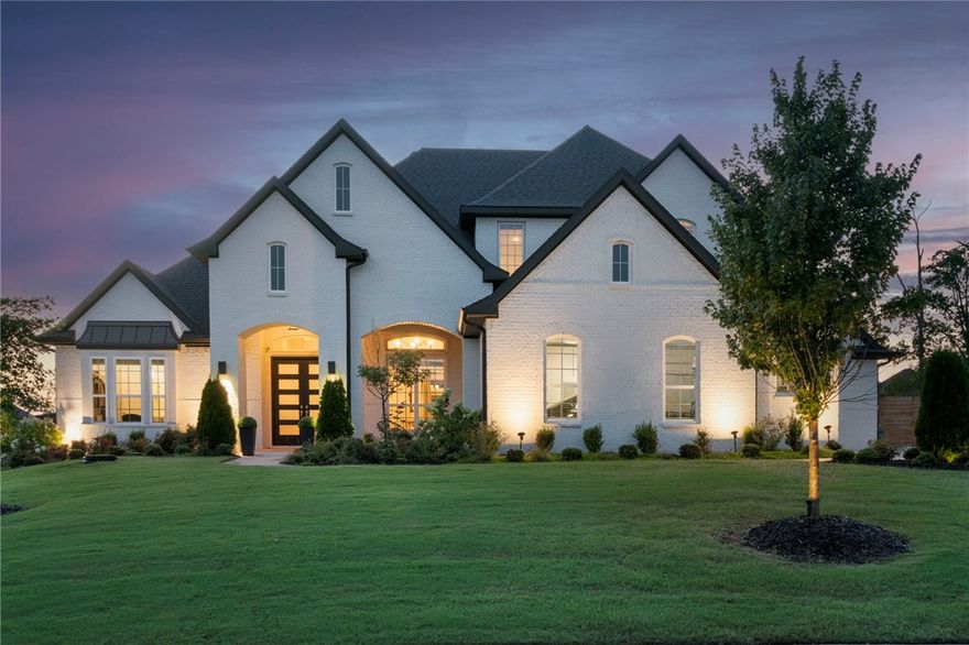 Designer’s dream! Looking for a trendsetting home full of character & lush w/ style-defining extras? From its intriguing use of color to the bold wallpaper selections & custom lighting, this incredible 2020 build is a show-stopper. Gorgeous front doors into a welcoming entry to discover hardwoods, Quartz countertops, beautifully hand-tiled showers, an oversized pantry, & a split plan that situates the owner’s suite, two bedrooms, and a flex room downstairs. Upstairs, find the media room along with a full bath & another bed, making this home well suited for families. Without a doubt, the home’s most outstanding features are found in the backyard of its .59-acre lot, where you can enjoy a cozy woodburning fireplace on the covered patio or vibe with in the 40ft, 8-ft heated fiberglass saltwater pool, complete with ambient color-changing lights and amazing sunset views! Truly, this better-than-new Otter Creek home is a total lifestyle and unlike any other you’ll find in NWA, w/ its many meticulously curated features.