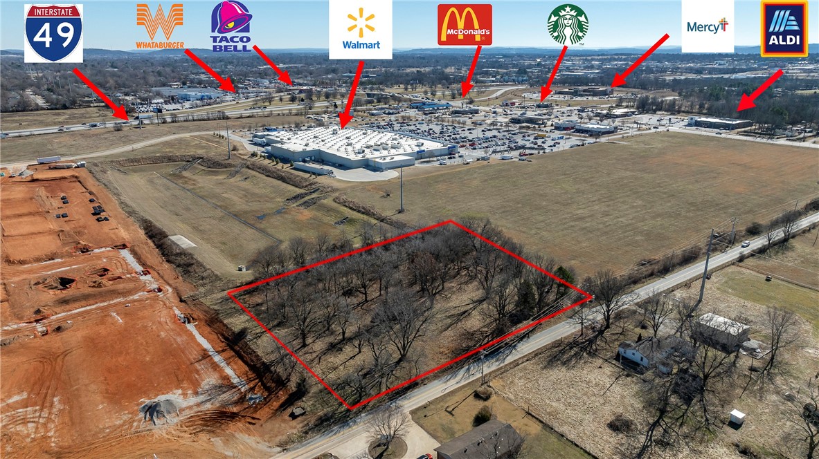 Prime Land. Per county records, any and all buildings on property were professionally torn down in 2017 along with septic tank filled. Two lots for sale side-by-side can be sold together or separately: #1309 with .5+/-acres and #1307 with 1.68+/-acres, totaling 2.18+/-acres, prime use could be development, commercial or retail. Vacant land adjacent behind WalMart Super Center, Arvest Bank & Retail space and located within a minute off a major interstate of I-49 and Elm Springs Rd exit to Oak Grove Rd. Now also near Starbucks, Mercy Hospital, Aldi Grocery and Storage Untis. Neighboring property is being developed into 300+ Apartment Complex that should be completed in 24-months or less.