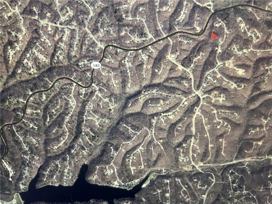 .38 acre Lot by the SBAT and Back 40 Loop Trailhead! Flo Ride, Go Ride, SBAT, Back 40 Loop, Taylor Homestead, SkipTown all in a 1 mile radius!  Less than 2 miles from lake Ann, one of only 3 wake-friendly BV Lakes.  Nestled among rolling hills, crystal-clear lakes, and mature trees, this property is ready for your dream home or investment build. Whether you’re looking for a quiet retreat, a vacation getaway, or your dream home in the Ozark Mountains with Big-City Access less than 10 miles away, this is your lot.  Benton County is the Mountain Bike Capital of the World and all of NWA is connected by Trail, offering Concerts, Festivals, Dining, Shopping and much more!  Come join the party and relax with us in the Recreation/Resort City of Bella Vista!