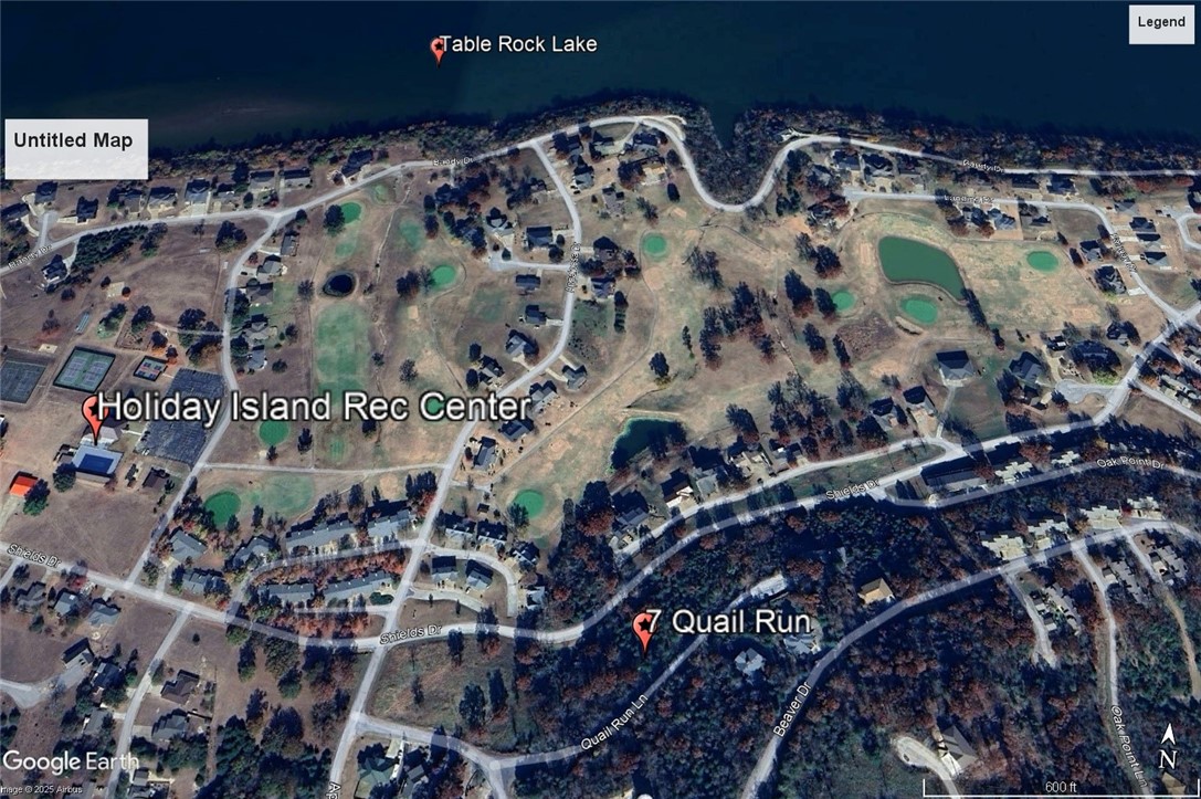 Ready to build your dream home? Spectacular vista with potential for year-round lake view. Access from both Shields Dr and Quail Run, the possibilities are awesome! Quiet and gently wooded within a neighborhood, this lot offers the best of both worlds. Enjoy the amenities in Holiday Island like golf courses, a country club, swimming, tennis and a marina with a fishing dock or watch the local fauna from your front porch! Nearby Eureka Springs or Rogers offers great shopping and vibrant cultural hubs.