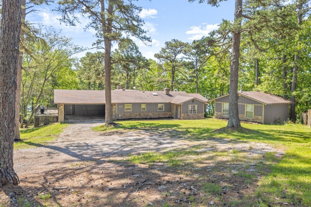 Beaver Lake, Lakefront home! Turnkey property, just steps away from self-adjusting boat dock with lift and oversized locker. One of a kind lakefront retreat that comes fully furnished. Beautifully remodeled with 4 bedrooms, 3 full baths in the main home. Finished walk-out lower level with bunk rooms and second living room. Wide plank flooring, vaulted ceilings, gas range with griddle & heat lamp, too many extras to list, see amenities list. Additional dwelling unit with kitchen and full bath. 180-degree year-round views! A remote and stunning location on the lake!