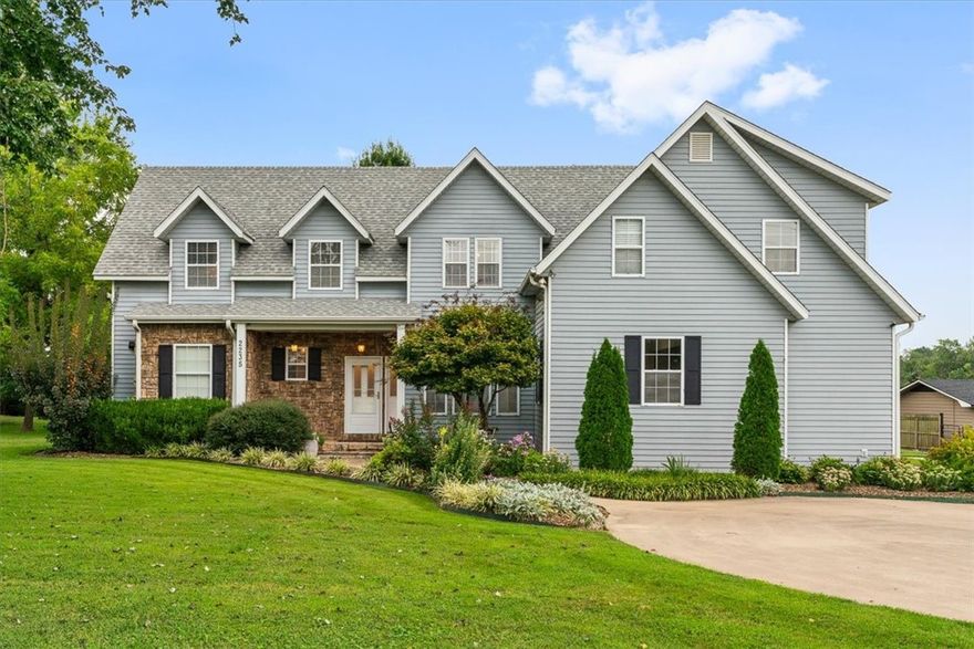 Beautiful 4-bed Rogers home on 0.76 acres. Features an office, bonus room, and a stylish kitchen with granite, gas range, and stainless appliances. Detached workshop and spacious yard. Recent updates include new windows. Move-in ready in a prime Rogers location.