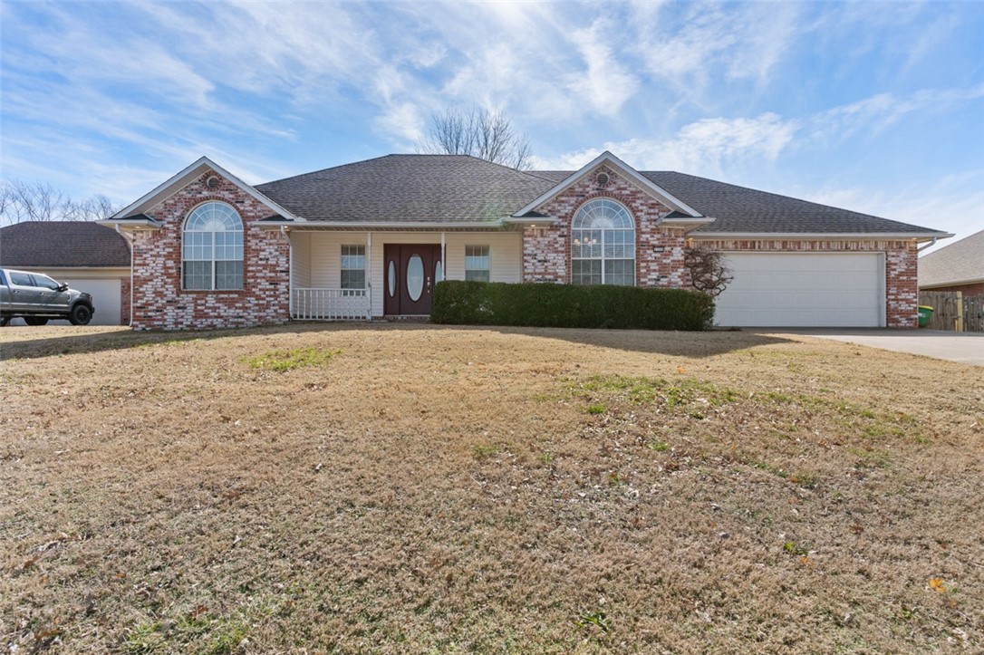 You're going to love this beautifully updated Springdale home! Conveniently located with schools, shopping, and the Downtown Springdale entertainment district all just minutes away, you'll also enjoy living steps from the gorgeous Razorback Greenway to keep you active and connected. This spacious split floor plan home features tall ceilings and built-ins in the family room, brand new LVP flooring, new lighting fixtures, stylish new hardware and fixtures, a cozy gas fireplace, two inch faux wood blinds, and a newer water heater to enjoy. Outside, relax on your covered patio overlooking a spacious fenced back yard with two storage buildings to convey. Book your showing to see this beauty today!