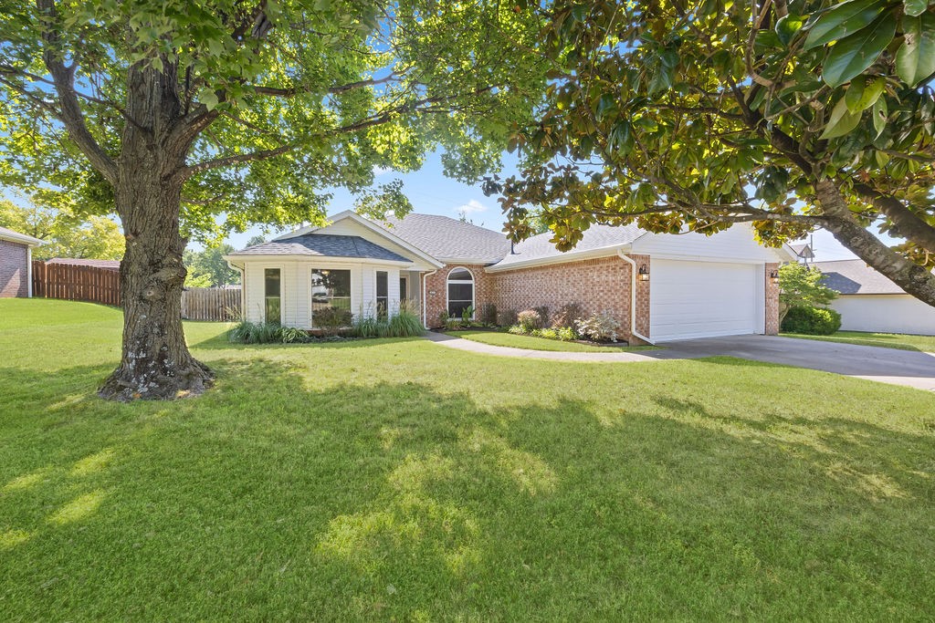 Darling home in the Blake Lane Subdivision! Wonderful living space with open layout, vaulted ceilings and corner gas-log fireplace that give the perfect place for any family gathering. Lovely eat-in kitchen is equipped with stainless steel appliances, wrap around counter giving space for bar seating and an abundance of cabinets giving plenty of storage options. Spacious bedrooms with split bedroom floorplan for functionality and privacy. Primary bedroom offers walk-in closet and custom shower. Many recent updates throughout including new roof, new countertops and much much more! Fully fenced backyard and open patio space provides the perfect place to watch the little ones play or simply unwind from the day. Established blueberry & blackberry bushes, pear tree and asparagus plants. Close to shopping, dining and entertainment with easy access to I-49 and 71-B. Moments from Lake Fayetteville and Clear Creek Trails. Move-in ready and waiting for you!