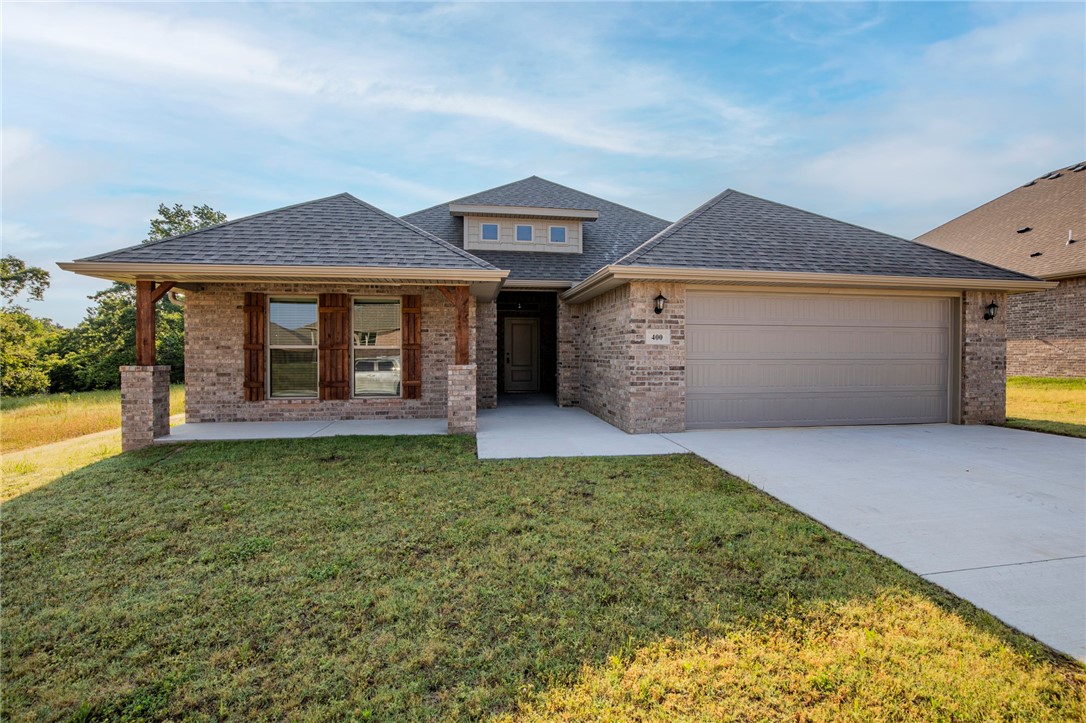 New Construction!!! Beautiful 4 bedroom 3 full bath home in Pea Ridge. Large open floor plan through main living area with wood style ceramic tile and high ceilings. Livingroom features fire place and opens into kitchen which includes stainless appliances, granite counters and a pantry. Bedrooms have carpet flooring. Master bedroom has trey ceiling and bath has large walk in closet, separate tile shower and soaking tub. Large covered patio off the back of the home. large yard, no fence.