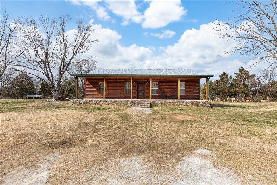 Located on 2.66 acres, this 3-bedroom, 2-bathroom cabin offers a blend of rustic charm and modern functionality. The open floor plan is filled with natural light, creating a warm and inviting space. The kitchen provides plenty of counter space for meal preparation and entertaining, while the spacious living area is perfect for relaxation. The primary suite includes an en-suite bath, and the two additional bedrooms can be used for family, guests, or an office. Outside, the 24x41 shop offers space for tools, equipment, or a workshop. With 2.66 acres of land, youāll have plenty of privacy, yet youāre only a short 8 minute drive from Huntsvilleās amenities. Whether you're looking for a weekend retreat or a permanent home with room to grow, this property is a great opportunity. Donāt miss out on this unique piece of Arkansas land.