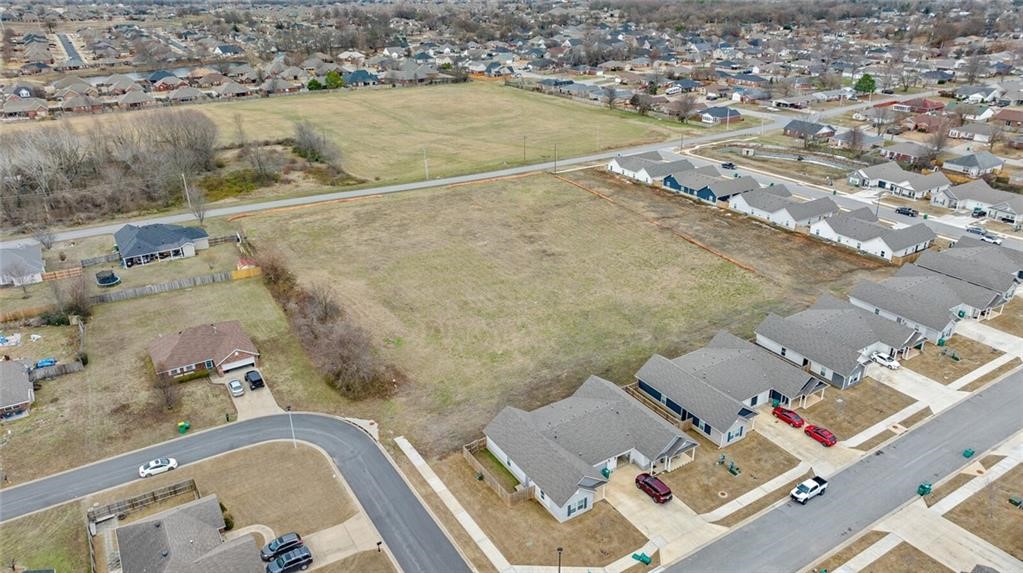Exceptional opportunity to own 3 acres of flat, cleared land in a high-demand area of Centerton. Boasting over 300 feet of frontage along highly visible Gamble Road, this prime parcel is just 0.3 miles from Bentonville West High School—making it ideal for residential or commercial development. Situated in the heart of one of Northwest Arkansas's fastest-growing regions, the property offers unbeatable convenience with close proximity to top-rated schools, major retail centers, restaurants, and daily amenities. City utilities are already on site, streamlining the development process. Whether you're an investor, developer, or business owner, this location delivers outstanding potential in a thriving community.