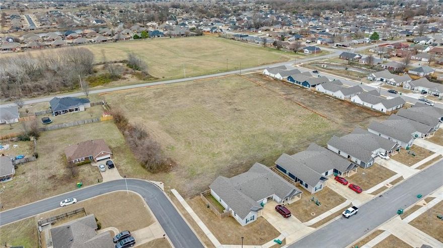 Exceptional opportunity to own 3 acres of flat, cleared land in a high-demand area of Centerton. Boasting over 300 feet of frontage along highly visible Gamble Road, this prime parcel is just 0.3 miles from Bentonville West High School—making it ideal for residential or commercial development. Situated in the heart of one of Northwest Arkansas's fastest-growing regions, the property offers unbeatable convenience with close proximity to top-rated schools, major retail centers, restaurants, and daily amenities. City utilities are already on site, streamlining the development process. Whether you're an investor, developer, or business owner, this location delivers outstanding potential in a thriving community.