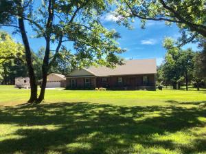 New Luxurious home on over 6 acres minutes from Clarksville. Enjoy your 24 x 24 detached shop and 4 car garage. Beautiful grounds, mature trees,fenced in garden, fenced in backyard also. Walk-through luxury with calm cool colors ,crown moldings, double tray ceilings ,hardwood floors, granite counter-tops throughout. Your master suite offers tray ceilings, lots of light, on suite with double sinks and walk-in closet, large tile shower with rain head and multiple Shower options. Enjoy your covered porches too. The attached garage offers a safe room for convenience. Lots of built-ins and custom cabinetry, kitchen island, stainless steel appliances . Enjoy over 1900 ft. of heated and cooled living space. Minutes from Lake Ludwig. Call for your private showing today.