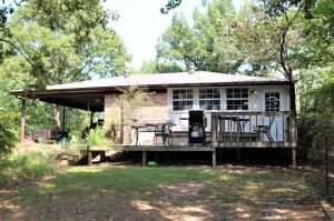 Are you dreaming of lake living? This adorable, updated, well cared for and fully furnished home is what you have been waiting for! Canoe, kayak, fish from your back yard and relax in the jetted tub after a full day! Two bedrooms, jack and jill bathroom and game/office/bonus room on basement level that can offer some storm protection as well. Roof and gutters are 8 months old. Most wiring and plumbing updated 5-6 years ago. Call today for a personal tour!