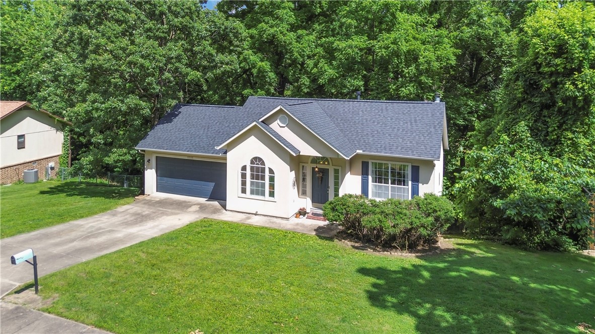 Adorable stucco home in a well-established, beautifully maintained neighborhood just minutes from JB Hunt Park and the Lake Springdale walking trail! This 4-bedroom, 2.5-bath home features all bedrooms on the basement level for added privacy. Enjoy a cozy living area with a wood-burning fireplace and an updated kitchen. The remodeled primary bath adds a modern touch, and the HVAC system has been recently replaced. A brand-new roof & gutters were installed this year. The seller has invested over $37,000 in improvements, including a new retaining wall—see attached list for details. Seller is offering $12,500 in escrow toward repairs for a leak that appeared during recent heavy rains. Two contractor bids have already been obtained. Property to be sold as is—a great opportunity to own in a desirable location with major updates already completed!