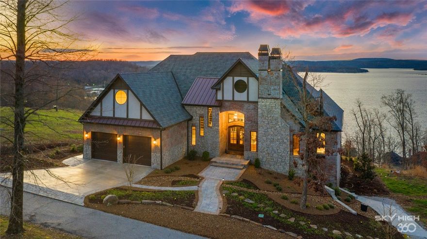 Situated on a coveted .44 acre lot, this exquisite custom built home provides a delightful fresh and modern ambiance. From the carefully manicured grounds to the spectacular Beaver Lake views, this home is truly picturesque and evokes a type of storybook charm.  Inside you’ll find wide plank hardwood flooring, an airy designer paint palette, high-end fixtures and finishes and picture windows that frame the magnificent lake views. This homes offers 6 bedrooms, 4 full baths, 1 half bath, 2 living areas, dining room and full walk-out basement with golf cart garage and storage!  The gourmet kitchen is boasting with design and style offering Viking appliances, custom pantry, spacious island and a fabulous eat in kitchen or sitting area with views to take your breath away!  This wonderful Beaver Lake property includes community clubhouse, pool, community boat dock with slip and offers a peaceful escape not far from town.