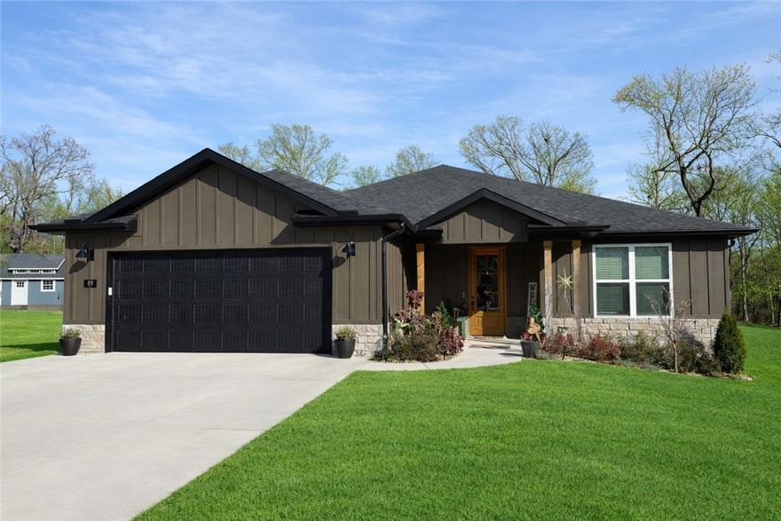 Welcome to this stunning, quality-built home on a rare half-acre lot! Thoughtfully designed, this home offers abundant storage, two entry coat closets & a convenient drop zone. The open-concept layout features a stunning kitchen, huge walk-in pantry, Frigidaire appliances, a built-in oven & gas cooktop. It flows seamlessly into a spacious living & dining area—perfect for entertaining large groups but also cozy enough for everyday use. The living room has a vaulted ceiling and a floor-to-ceiling fireplace. Door & window headers throughout highlight the craftsmanship. The laundry room includes a folding & hanging area. The primary suite offers a gorgeous tiled walk-in shower, double vanities, and a large walk-in closet. The guest bedroom could be an office and has a private bath. Two additional bedrooms share a Jack-and-Jill bath with double sinks and a deep soaking tub. Bonus sprinkler system, covered patio with a TV & sun shades. The patio extends to a sun deck.  3 bdrm septic.  Don't miss out on this opportunity!