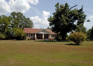 TRULY A ONE OF A KIND PROPERTY! An historic schoolhouse, built in 1926, has been completely updated in the past couple of decades incl. HVAC, plumbing, wiring, appliances, windows, etc. Between Harrison & Branson & close to Hwy 65N. Home also has original h-wood floors & comes completely furnished! Addt'l 20X30 building is plumbed & has Elec. & could be living area with some work. See Supplement!
