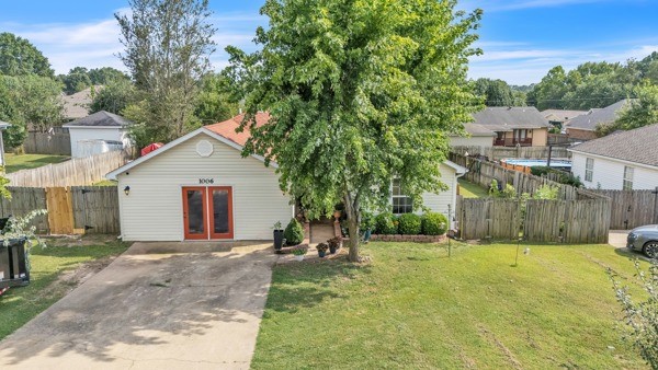 Welcome to this beautifully maintained 3-bed, 2-bath home featuring an inviting living space with thoughtful updates throughout. Enjoy the large master bedroom with a generous oversized walk-in closet & a custom-tiled shower in the ensuite bathroom. The cozy living room includes a gas fireplace & flows seamlessly into the eat-in kitchen, complete with oak cabinetry & plenty of space for dining. The garage has been converted into a versatile office space, ideal for remote work or a home studio. Step out onto the back deck, perfect for relaxing or entertaining & enjoy the fully fenced backyard. A storage building also conveys with the property. Conveniently located in Rogers, youāre just minutes from shopping, dining, & local amenities.