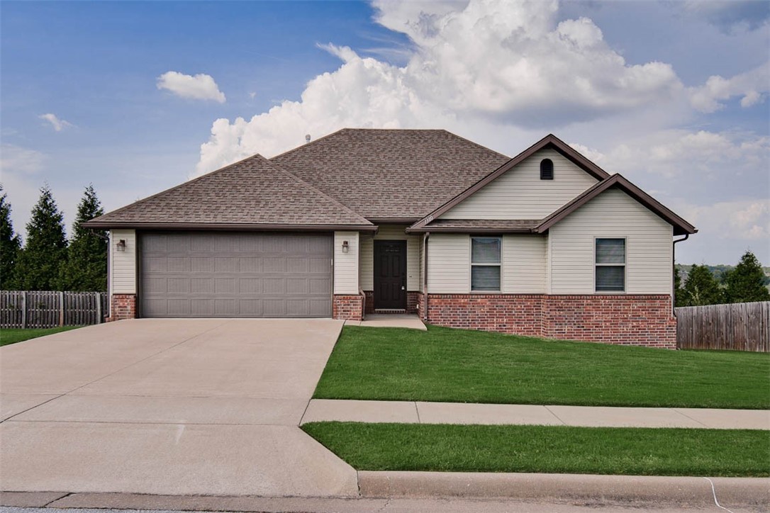 Very well-kept home - a steal of a deal! This 3 BR, 2 BA home is in tremendous condition. New carpet in the bedrooms, wood laminate everywhere else, all new interior paint, granite countertops, nice yard, fantastic oversized wood deck with a great view out back, 2 car garage with overhead storage, gutters, & lots more. Come see this one! Agent owned