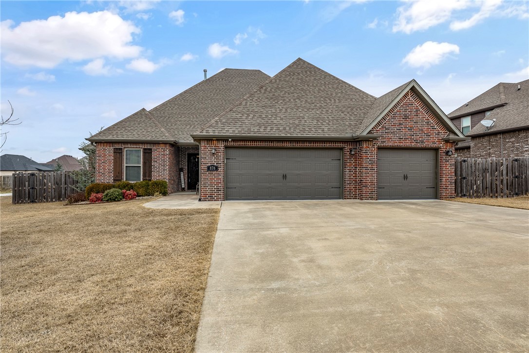 Fantastic home located in Tuscany subdivision (West Springdale /Tontitown.) This home offers an open floorplan with 5 bedroom, 4 full baths, formal dining, media/bonus room and 3 Car Garage. You will love all the amenities including: extra storage space, wired for surround sound, security system, & central vac, keyless entry, large walk-in closets, spacious living room, fireplace with gas logs, built-in bookshelves. Kitchen has stainless appliances, 5 burner gas cooktop, walk-in pantry, backsplash, bar/island. The primary suite has double sinks, whirlpool tub , tiled walk-in shower, large walk-in closet that opens into the spacious laundry room. The primary suite, three additional bedrooms, two bathrooms located on lower level, and large media room /bonus, full bath & 5th bedroom upstairs. hardwood floors on lower level, new hardwood flooring added to upper level in 2023. The neighborhood HOA includes 2 pools, multi-sport game courts, playground. Great location close to schools, shopping, hospitals and I-49.