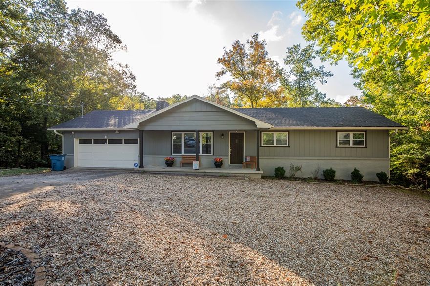 Tucked quietly at the end of a cul-de-sac, this beautifully updated 4-bed, 3-bath Bella Vista home backs directly to the Bluff Out Trail, offering instant access to nature and privacy surrounded by trees. The main level features a bright, open living space with a wood-burning fireplace, granite countertops, stainless appliances, and hard-surface flooring throughout. The primary suite includes a remodeled tiled shower, and the home shines with fresh paint, windows, updated lighting, and flooring 2021. The finished walkout lower level adds a bedroom, full bath, and plumbing for a kitchenette—perfect for guests, multigenerational living, or a home business. Step outside to enjoy a fenced .45-acre lot with a deck, new chimney, gutters and guards, and improved drainage. Major updates include 2019 roof, 2022 HVAC and water heater. Close to Metfield Park and trailheads, this home blends comfort, connection, and the best of Bella Vista living.
