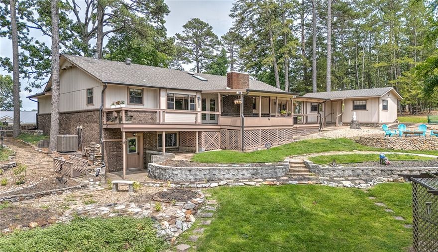 Live the lake life you’ve been dreaming of! This charming lake house offers year-round lake views and shared dock access with a private boat slip, lift, and swim platform—perfect for sunny days on the water. Inside, enjoy an open floor plan designed for relaxed living, featuring a woodburning fireplace and beautifully updated maple kitchen cabinets. Two bedrooms and two full baths are located on the main level, with a third bedroom below-great for guests. Step outside to entertain or unwind on the oversized deck, part covered, part open-ideal for grilling or stargazing. The backyard is made for lake evenings with a cozy firepit and room to play. A 364 sq ft heated/cooled bonus building offers flexible space for a lake bunkhouse, remote office, or your own he/she shed. A 160 sq ft storage shed adds even more convenience. Added BONUS-a buildable lot on either side of home!  Whether boating, swimming, or just soaking in the views, this home is your gateway to lakeside living at its best. Don’t miss this lakeside gem!