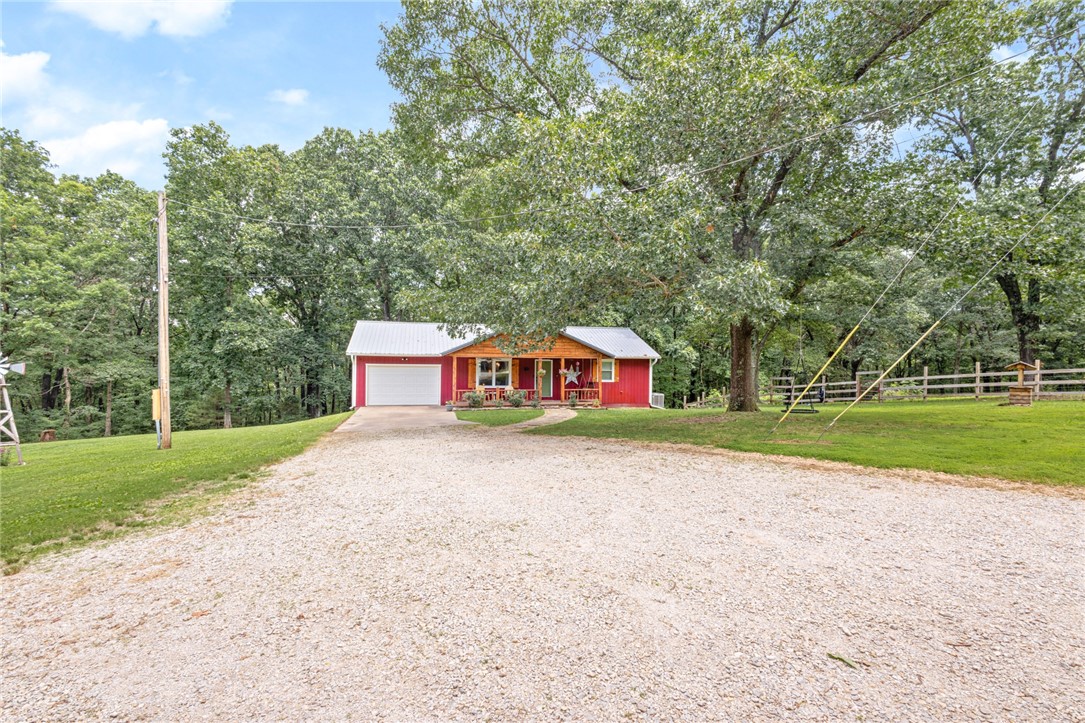 ***$10,000 Buyer Concession! TWO HOMES on over 11 acres in the heart of NWA! This peaceful, beautiful hobby farm sits on the boarder of Pea Ridge and Bella Vista, bikeable to the north Back 40 Mountain Bike Trail and less than 15 minutes to I-49 Bentonville/Bella Vista exchange! With minimal building restrictions, the development opportunity on this acreage is endless! Main home is fully upgraded offering 3B / 2.5B, NO carpet, oversized laundry/pantry/mud room, large downstairs bonus/rec room and plenty of outdoor relaxation and entertainment options with a covered front porch, covered back deck and patio. Guest Home is 500+sf of open floor plan studio space with private full bathroom, laundry, walk in closet and garage. Approximately 2+/- acres fenced for livestock. Recent upgrades: Well pump, control box and pressure tank replaced 2022. Guest home roof replaced 2022. Main home renovations 2021. Main home windows new in 2019.