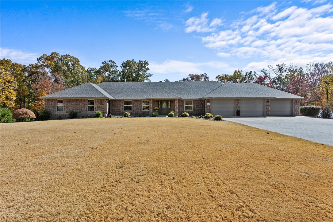 Discover casual luxury in this custom-built, fully ADA-compliant home nestled in a peaceful neighborhood. Offering 5+ bedrooms,4.5 baths with 4 oversized attached garages. The spacious kitchen is a dream with an abundance of cabinetry, pull-out drawers, lazy Susans, and two appliance cabinets to keep your countertops clutter-free plus a large island. A separate apartment offers options for in-law quarters, a suite for guests, or college student retreat. The primary closet is partially cedar-lined for a touch of rustic elegance. Enjoy the no-maintenance tech deck installed just last year. Central vac system for both levels and an elevator. Downstairs features abundant storage, plenty of flex space for a multitude of uses, and a safe room with two concrete walls for added peace of mind, while the walk-out basement opens to a large patio for outdoor entertaining. The 4th car heated and cooled garage provides endless possibilities for shop, boat storage, or a workshop. New roof 2024. Two new heat and air units 2022.