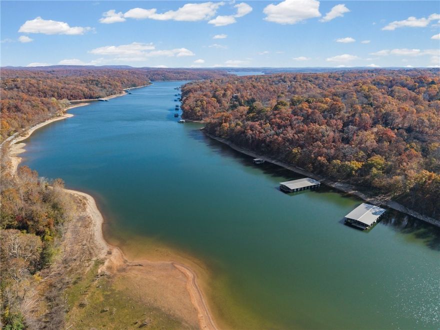 Its the perfect time to plan your lake house on this 1.34 acres with a boat slip!!!! Slip is located off Vail Drive Dock 2 slip 6. Land adjacent also for sale by a separate owner if you wish to secure more land and privacy!!!! This land is just a short drive away from Downtown Rogers to shops, restaurants, shopping and more. Prairie Creek Marina is close for fueling up your boat or grabbing snacks while on the water. Fall is the perfect time to plan for all your summer fun!!!!