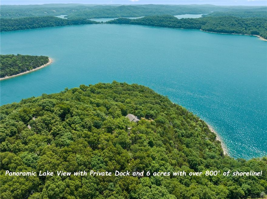 Located out on the point off of castle cove, with mesmerizing big water views, over 800' of shoreline, private 2-stall dock with lift, 6 usable acres with trails, bluffs, and picnic area along the shore, this magnificent home is truly the pinnacle of lake living!  As you walk through the front door, the panoramic lake view immediately welcomes you!  You'll also appreciate the cathedral ceiling, stone fireplace, powder room for guests and solid-wood floors throughout.  The spacious kitchen boasts a large island and is well appointed with high quality custom cabinetry.  A spacious maser suite is locaed on the main level and also offers a spectacular view!  Three spacious bedrooms, two of which boast amazing views, and a full bathroom are located down stairs.   The home has been meticulously maintained, has new, high quality carpet, and is being offered with most all of the furnishings.  Additionaly, the detached garage has electric, water, and a vaccuum system for woodworking!
