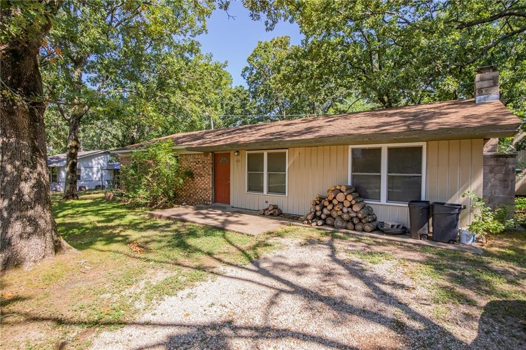 Quaint ranch-style home in Decatur with 1,463 square feet on a .24-acre lot. The front porch introduces the single-level layout, where open living spaces connect seamlessly for easy everyday living. The kitchen includes an updated dishwasher, while three bedrooms and one and a half baths offer comfortable function. A fenced yard enhances outdoor enjoyment, with room for pets or play. With classic charm, practical updates, and the ease of ranch design, this home balances affordability and small-town appeal just minutes from Northwest Arkansas conveniences.