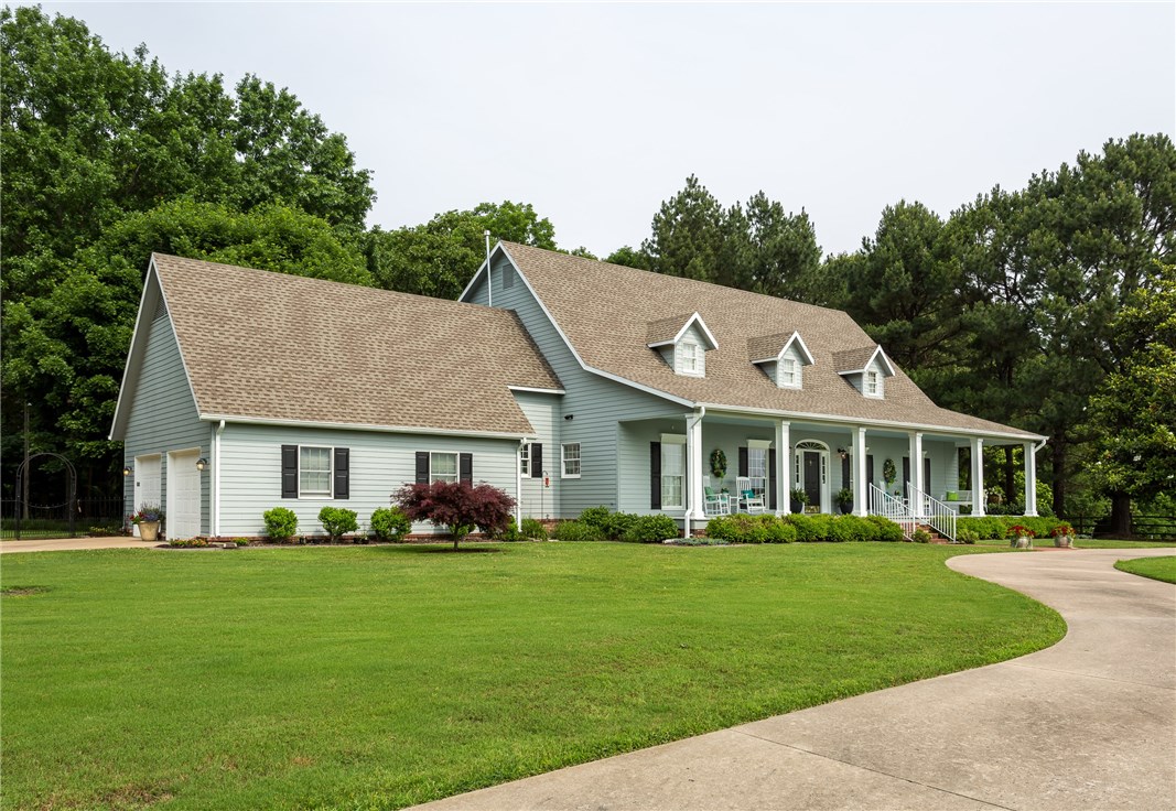 Southern Living Charmer. 26+ac Rare property,serene and quiet setting not visible from hwy. Hobbyist's Greenhouse & Gentleman's Fruit orchard, small pond, equipped for 200A/240V Generator w/ line disconnect, Anderson windows. Spacious kitchen remodel/2017, solid oak floors refinished/2017, tons of natural light, Bonus/Home school room, 2 detached wkshps, hvac xtra storage, landscaped kept by a master gardener. Beautiful views from porch, back deck & a large bricked patio area. Paved driveway.