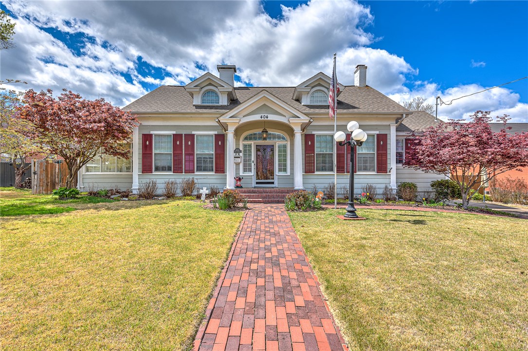 Welcome to this exquisite piece of history nestled in the heart of downtown Rogers! This charming home, placed on the historic register and nominated for National Historic Place. Boasting 3022 sq ft, this 3 bedrooms and 2 baths, exudes timeless elegance with original pine wood floors, crown molding, and French doors adorned with original crystal knobs. The historic charm is preserved throughout, offering a glimpse into the rich architectural heritage of the area. Embrace the convenience of downtown living with a walkable and rideable location. The kitchen has been partially renovated, featuring quartz countertops, new appliances, and hardware, seamlessly blending modern functionality with historic charm. Prepare meals in style while preserving the character of the home. Outside, a pull-through driveway with a carport offers convenient parking, while a detached storage building provides ample space for storing tools and outdoor equipment. Mini Split 2 yrs old, Roof 2016, HVAC about 11 yrs, Water Heater 5yrs