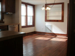 Charming older home newly remodled 2BR, 2BA, large utiltiy/mud room, large one car garage, beautiful wood and tile floors throughout, large wrap around front porch, stainless appliances, pellet stove, CH/A, 1.5 acres with commercial potential.