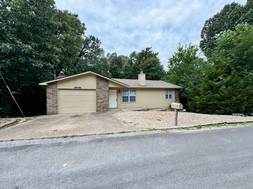 Updated interior featuring a cozy gas fireplace! Enjoy the outdoors from your screened back deck overlooking a level lot with mature trees. Perfectly located near shopping, golf courses, and world-class bike trails—including the Tanyard Creek facility and upcoming OZ Bike Park with a year-round lift. Bella Vista living offers 7 lakes, 7 golf courses, pickleball, tennis, and 3 rec centers. Come see why everyone is falling in love with this home and the incredible Bella Vista lifestyle